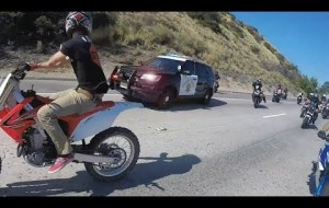 Cop tries to stop group of bikers.. Then this happens....